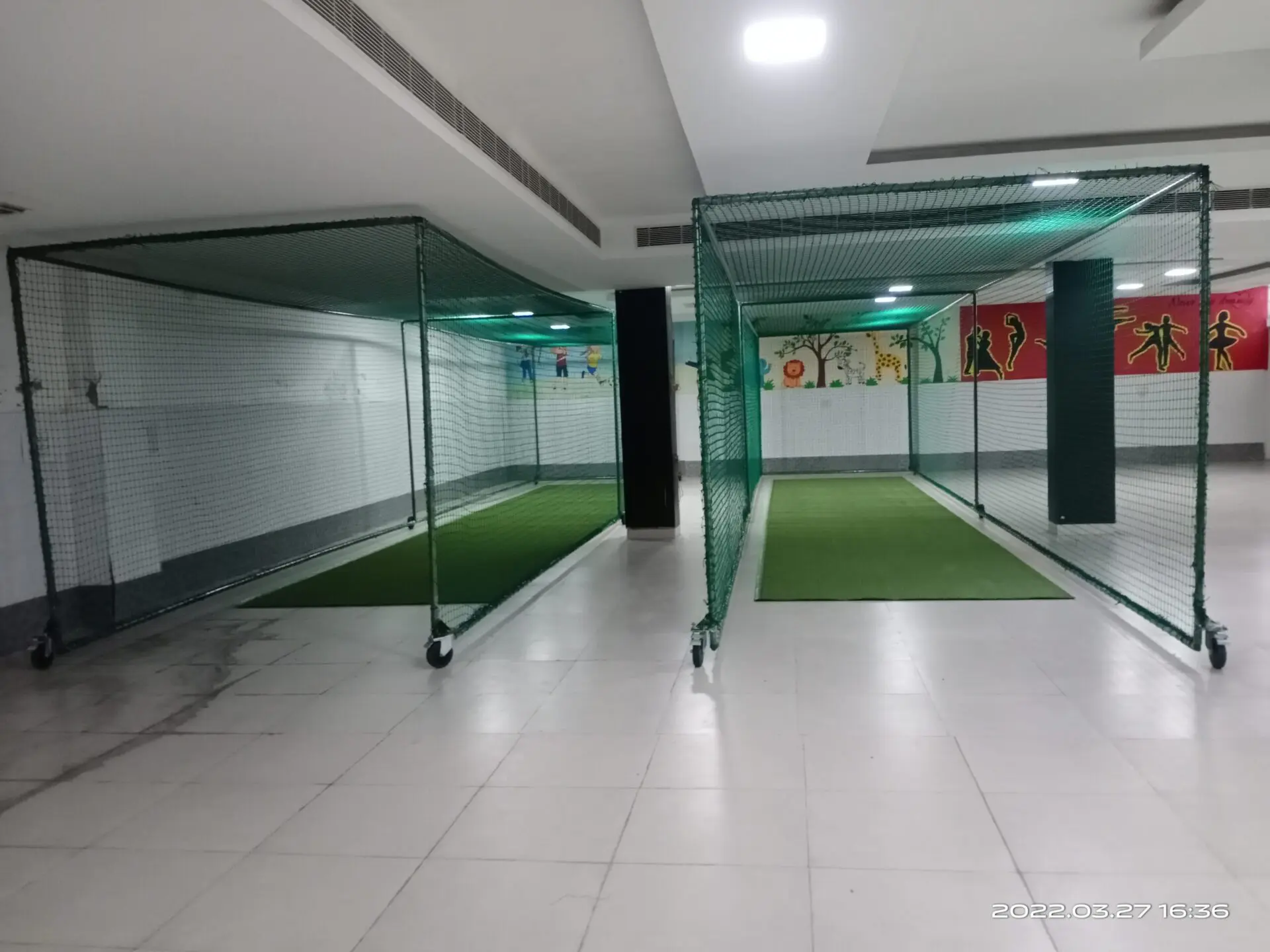 Ajaib Enterprises Portable Indoor Cricket Infrastructure: Two freestanding, portable cricket nets.