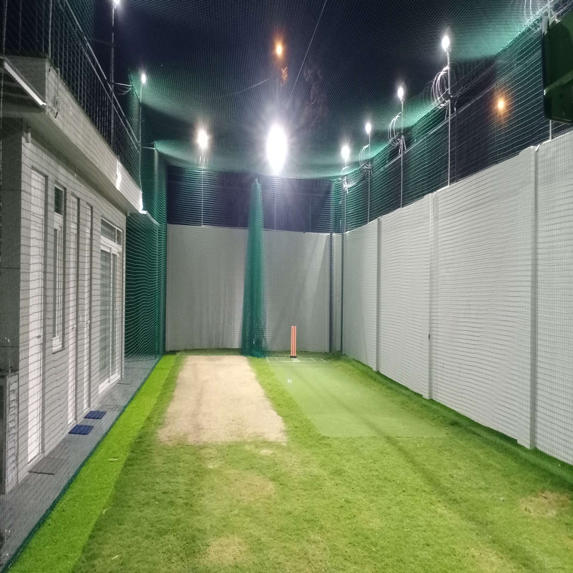 Ajaib’s Cricket Practice Infrastructure: Cricket Pitch with practice nets.